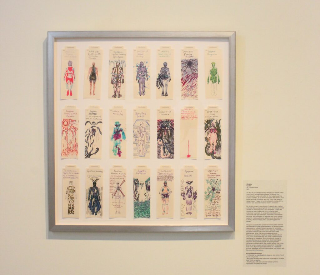 bookmarks framed and on display in a gallery. There are three rows of seven bookmarks. the first row is mostly visualizing physical symptoms like migraines and spodylitis, the second row grows to include cognitive symptoms including shame and summer depression, and the third tow grows to include socio-political effects, such as failing support systems and for-profit health insurance companies. it is framed with what looks like clinical brush aluminum on a white matte which makes the manila of the bookmark backgrounds pop. to the right is a typical gallery plaque with piece information, but also an artist statement and accessibility summary.