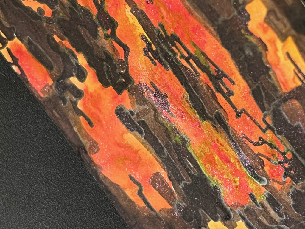 close up on the lower part of the bookmark, showing a lot of the golden reflections in the foot-area, and a rising stream of embers that drift up like smoke